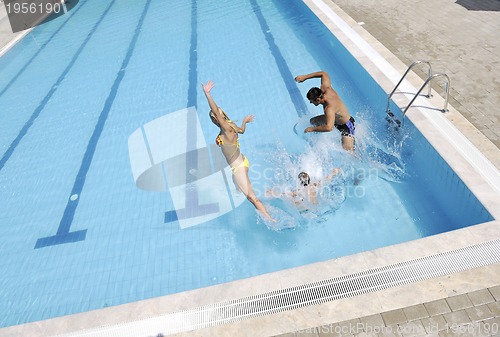 Image of happy young family have fun on swimming pool