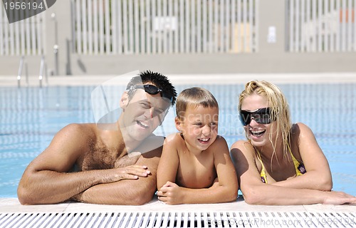 Image of happy young family have fun on swimming pool