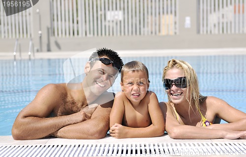 Image of happy young family have fun on swimming pool