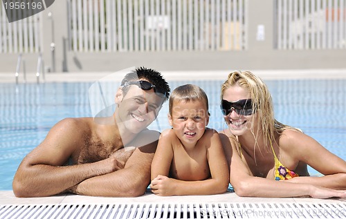Image of happy young family have fun on swimming pool