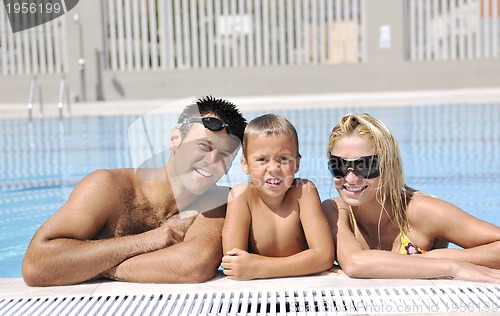 Image of happy young family have fun on swimming pool