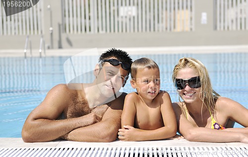Image of happy young family have fun on swimming pool
