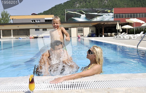 Image of happy young family have fun on swimming pool
