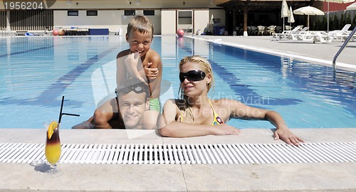 Image of happy young family have fun on swimming pool