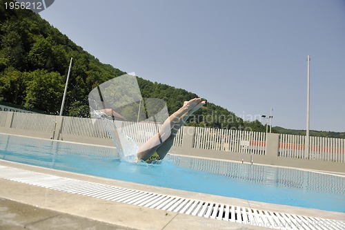Image of beautiful woman relax on swimming pool