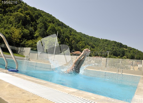 Image of beautiful woman relax on swimming pool