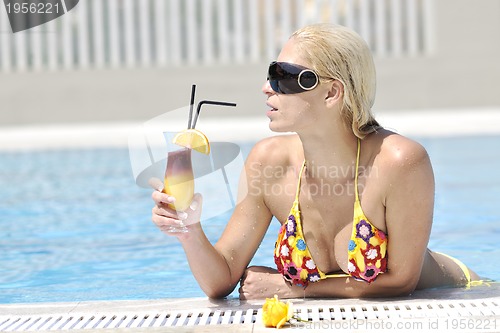 Image of beautiful woman relax on swimming pool