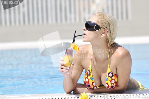 Image of beautiful woman relax on swimming pool
