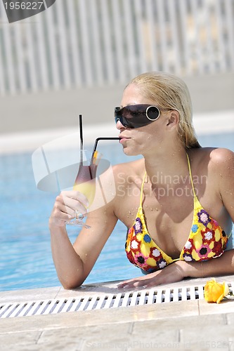Image of beautiful woman relax on swimming pool