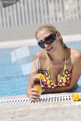 Image of beautiful woman relax on swimming pool