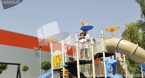 Image of family portrait at park playground