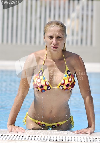 Image of beautiful woman relax on swimming pool