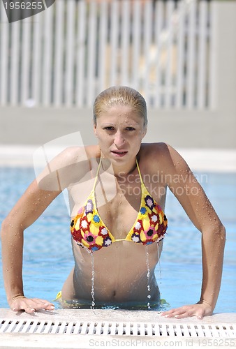 Image of beautiful woman relax on swimming pool