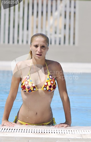 Image of beautiful woman relax on swimming pool