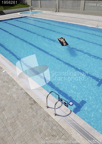 Image of beautiful woman relax on swimming pool