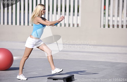 Image of woman fitness exercise at poolside