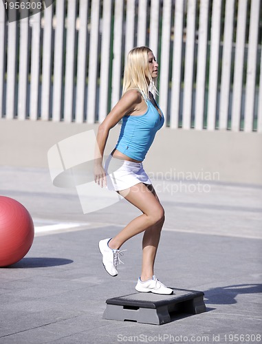 Image of woman fitness exercise at poolside