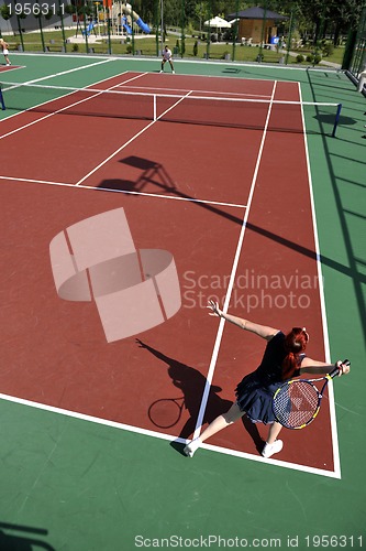 Image of young man play tennis outdoor