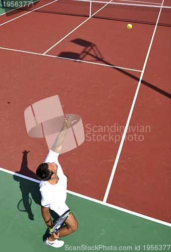 Image of young man play tennis outdoor