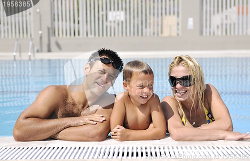 Image of happy young family have fun on swimming pool