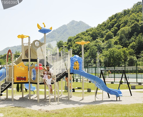 Image of family portrait at park playground