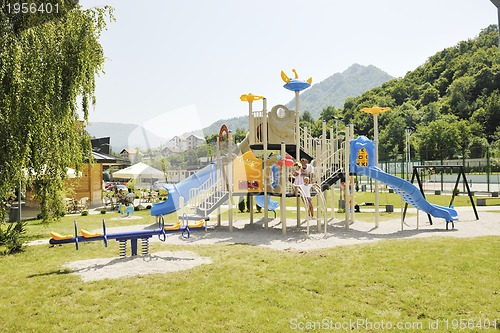 Image of family portrait at park playground