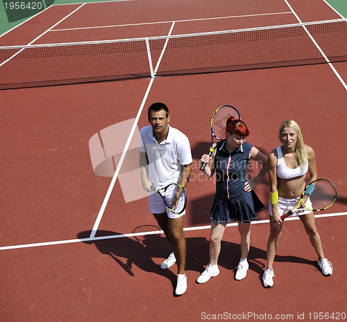 Image of happy young couple play tennis game outdoor