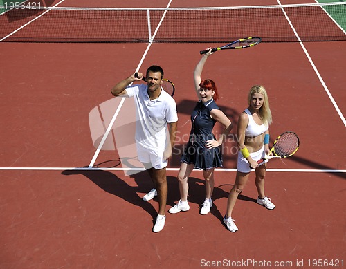 Image of happy young couple play tennis game outdoor