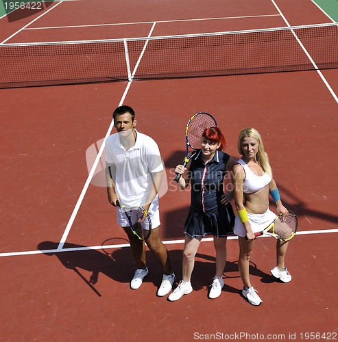 Image of happy young couple play tennis game outdoor