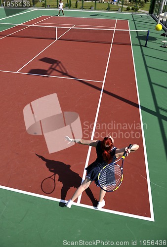 Image of young woman play tennis game outdoor