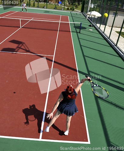 Image of young woman play tennis game outdoor