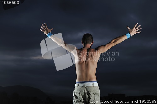 Image of Man with his arms wide open