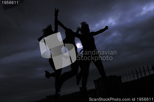 Image of teens jumping in air ready for party
