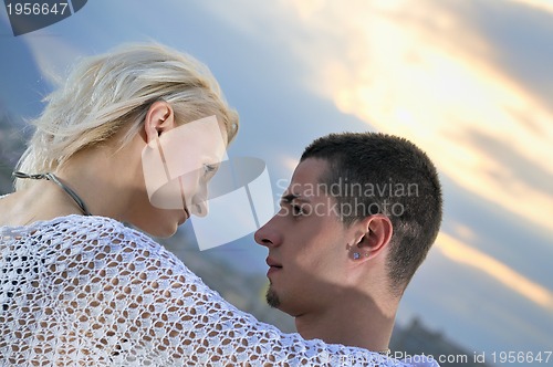 Image of romantic urban couple dancing on top of  bulding