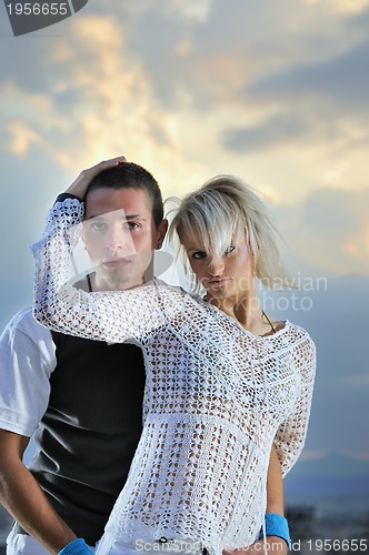 Image of romantic urban couple dancing on top of  bulding