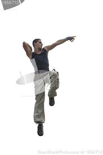 Image of young man jumping in air outdoor at night ready for party