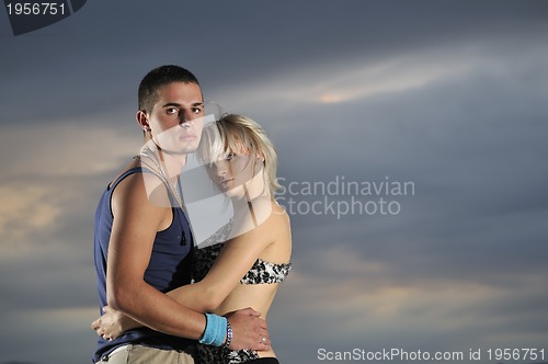 Image of romantic urban couple dancing outdoor