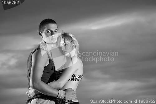 Image of romantic urban couple dancing outdoor