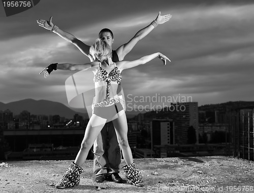 Image of romantic urban couple dancing outdoor