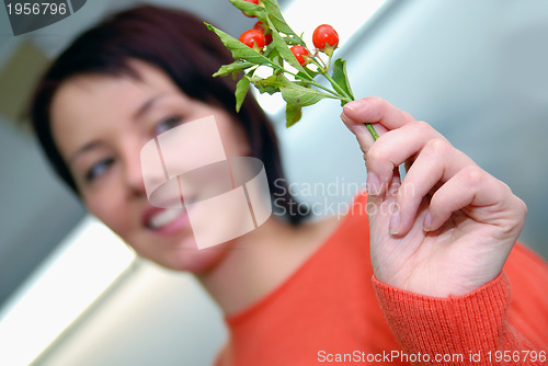 Image of Beautiful  girl holding young plant