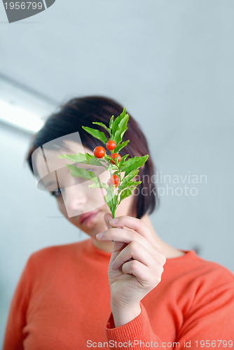 Image of Beautiful  girl holding young plant