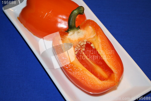 Image of Orange paprika, blue background