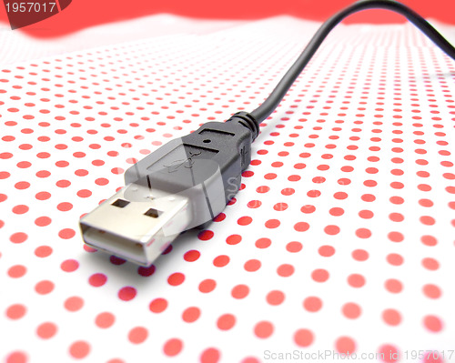 Image of usb cable on dotted background