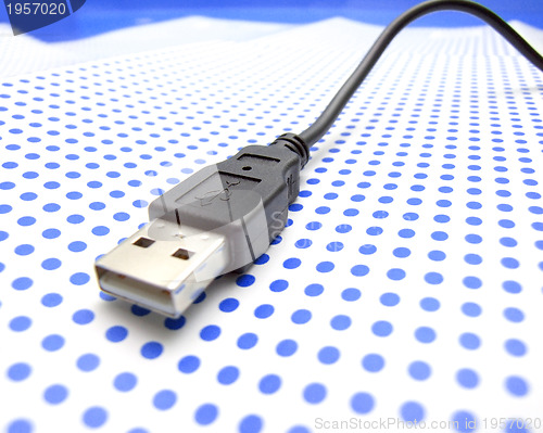 Image of usb cable on dotted background