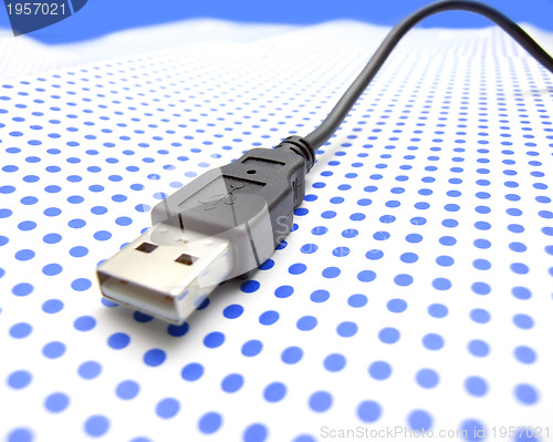 Image of usb cable on dotted background