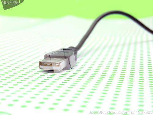 Image of usb cable on dotted background