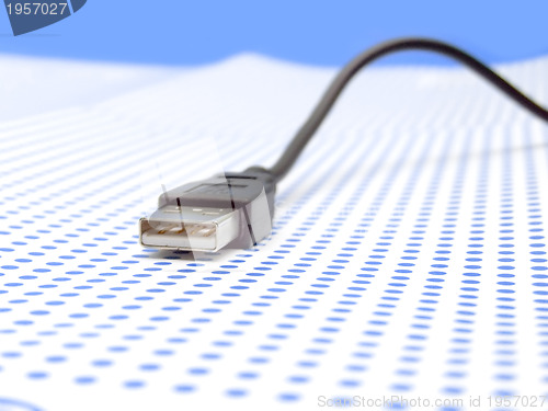 Image of usb cable on dotted background