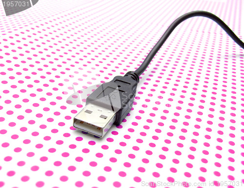 Image of usb cable on dotted background