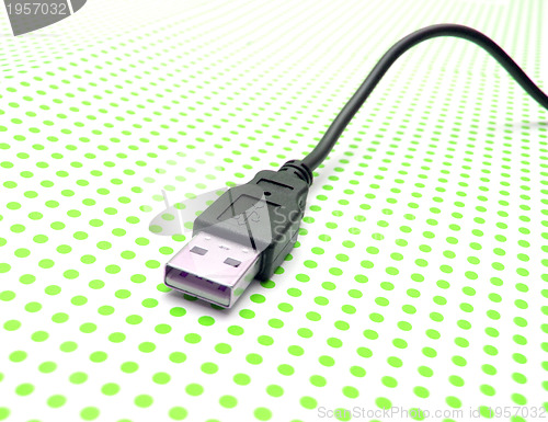 Image of usb cable on dotted background