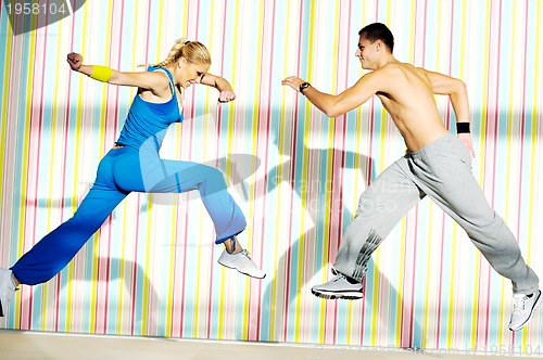 Image of young adults group in fitness club